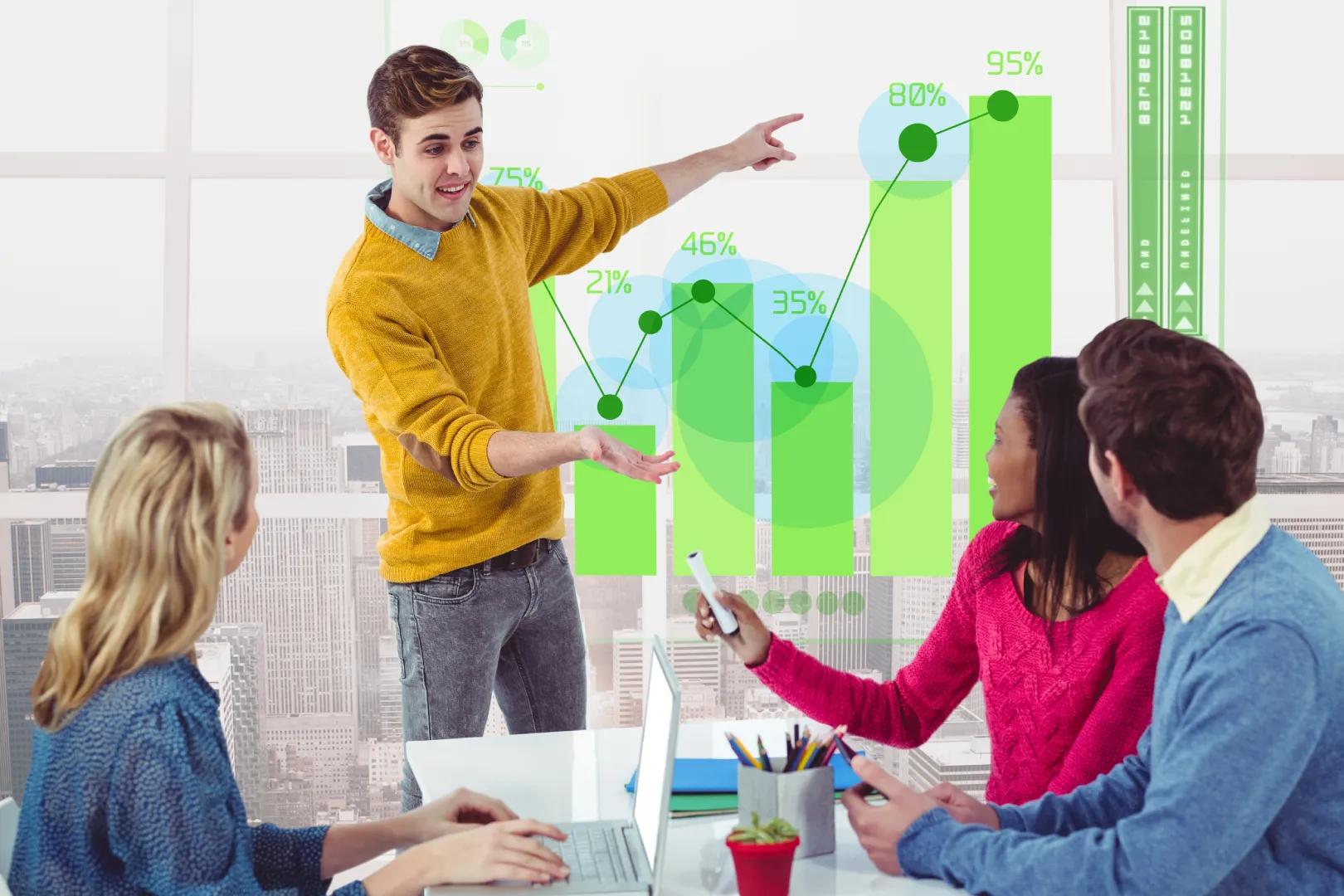 creative-monitor-tech-digitally-generated-desk Team of young professionals in a modern office discussing business growth data with bar and line graphs digitally overlaid in the background.